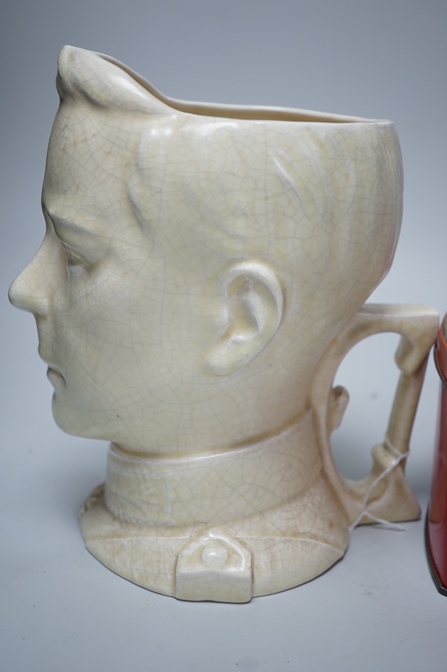 A musical Edward VII Coronation jug playing ' God save the King' and an Edward VIII biscuit tin